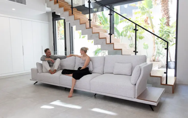 Contemporary sofa upholstered in Space fabric, a soft-textured and durable textile that brings warmth and elegance to the living room.
